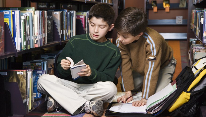 Students working on homework in library.