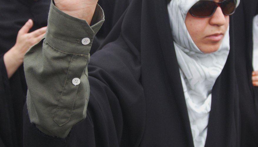 An Iranian woman protests against the desecration of the Quran.