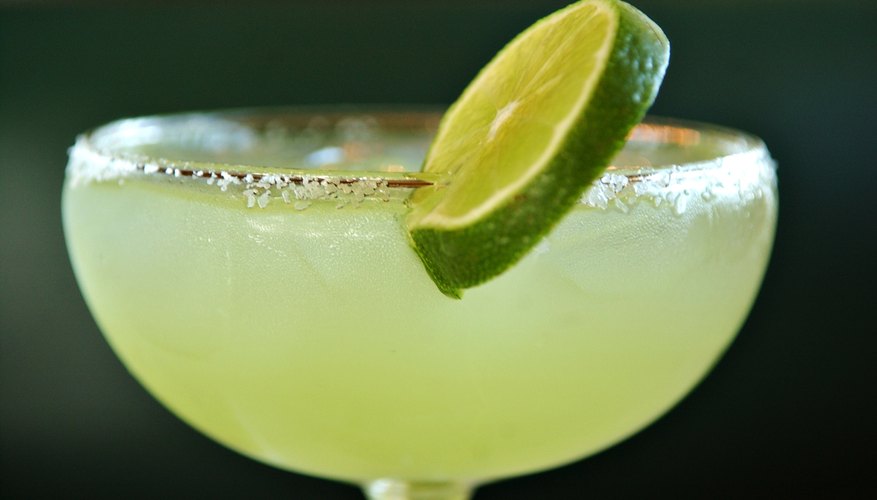 A close-up of a margarita with lime.