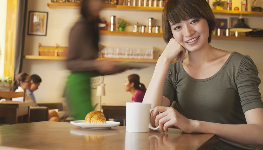 A Japanese woman is smiling at the camera.