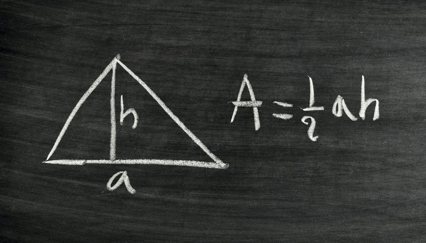 Triangle area formula written on chalkboard.