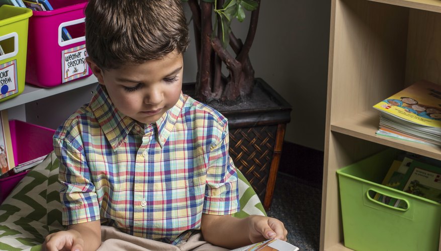 The preschool library corner provides a place for preschoolers to explore picture books.