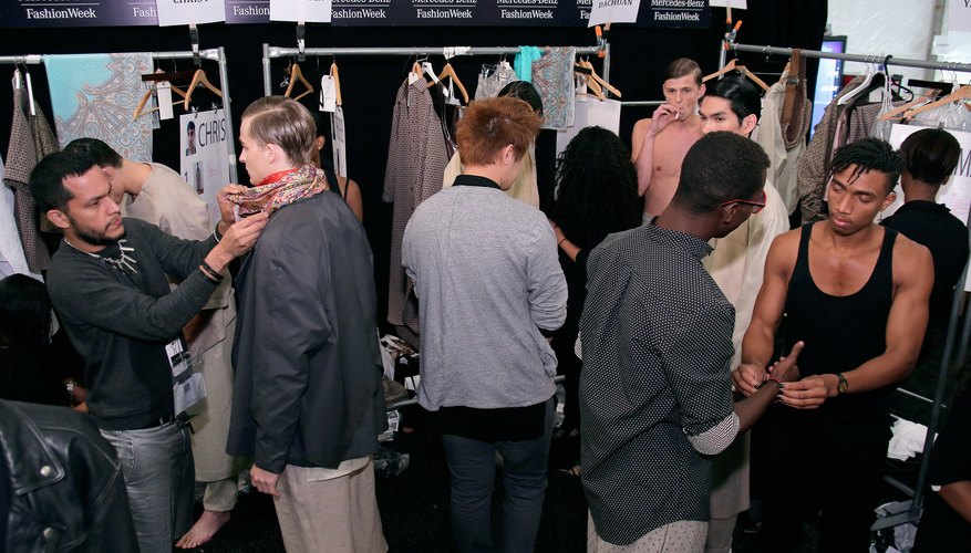 Models prepare for an Academy of Art University fashion show.
