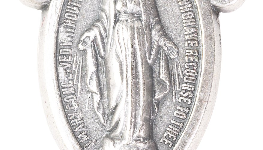 Religious medals are often attached to chains or rosaries.