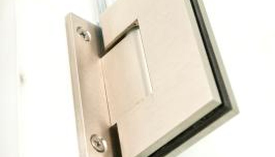 Frameless pivot shower doors have a few different hinge styles.