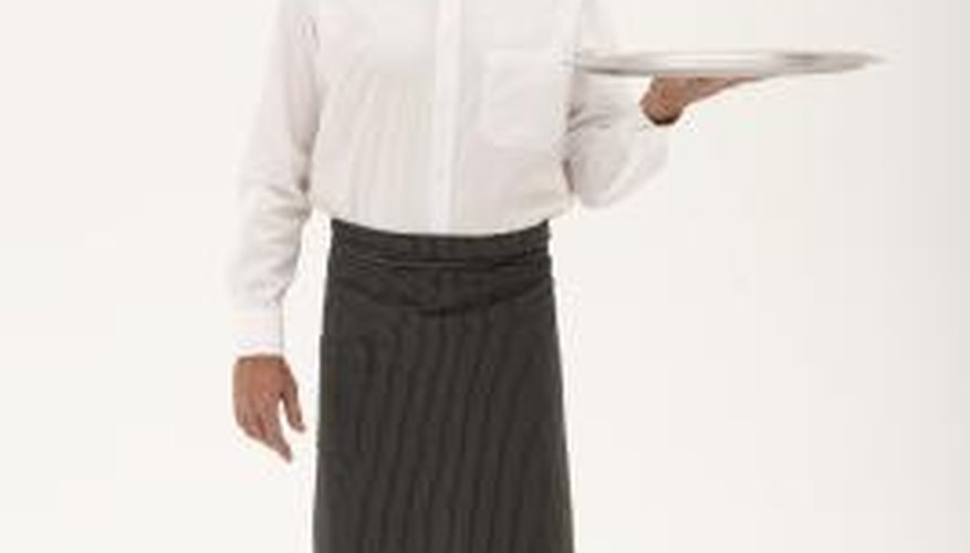 A Greek waiter's costume is inevitably black and white.