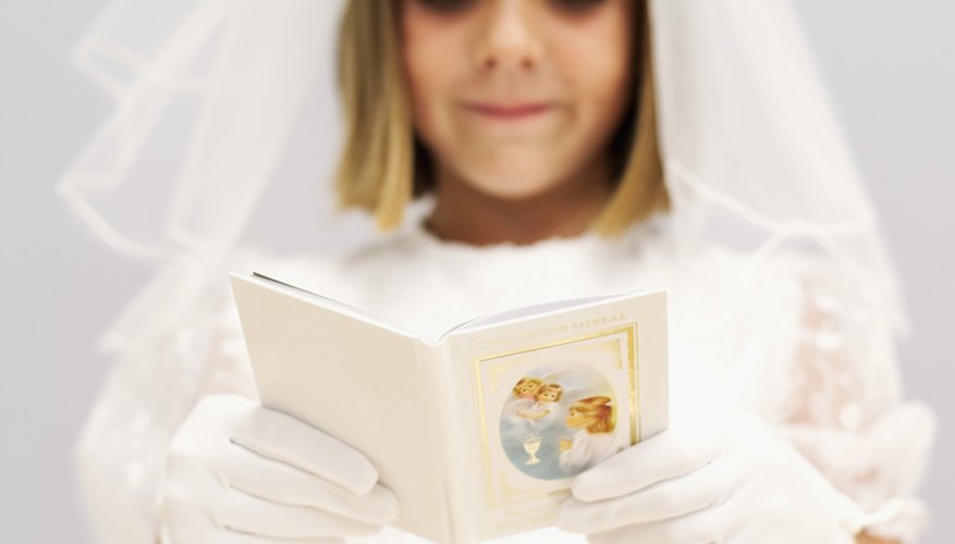 Children pray simple Catholic prayers during First Communion.