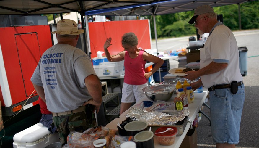 Members of a Moose lodge hosting a bbq for a charity event.