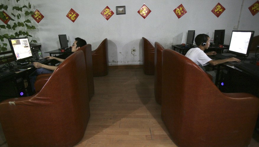 People surf the web at an Internet cafe in China