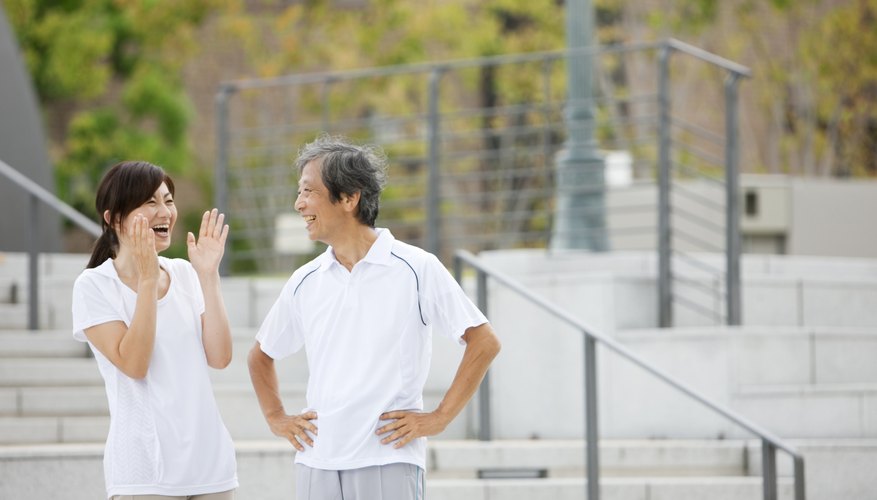 Woman and man having conversation outside.