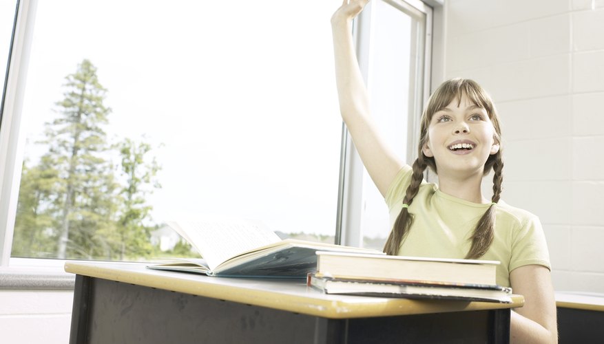 Girl raising hand in class