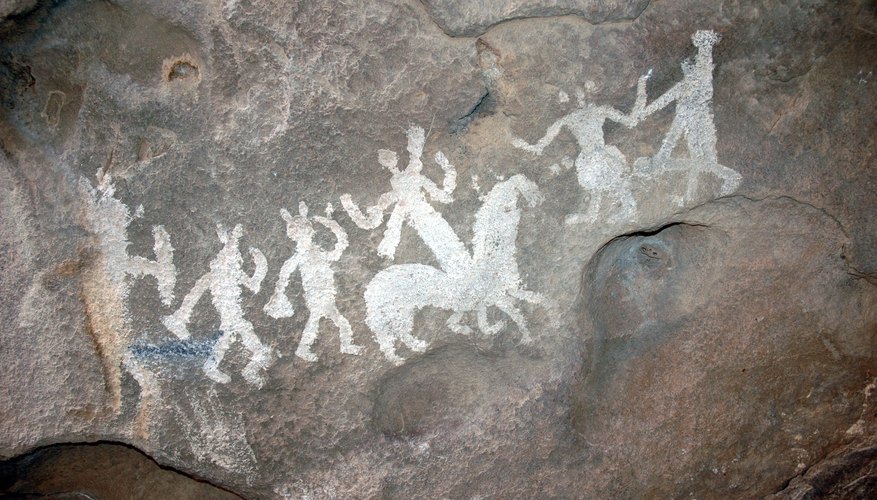 Apache painting on cave wall.