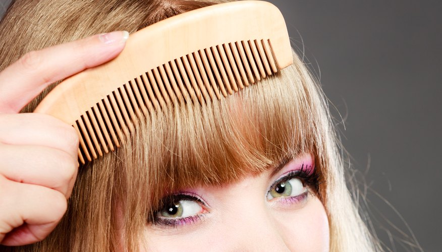 Side-swept bangs like Emma Stone's are ideal if you want to ease your way into a fringe hairstyle.