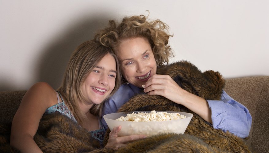 Rent a funny movie and laugh the night away with your mom.