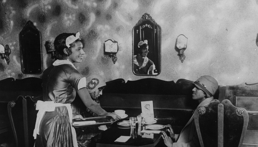 Harlem Renaissance women often adorned their bell-shaped cloche hats with appliqués, feathers, flowers or brooches.