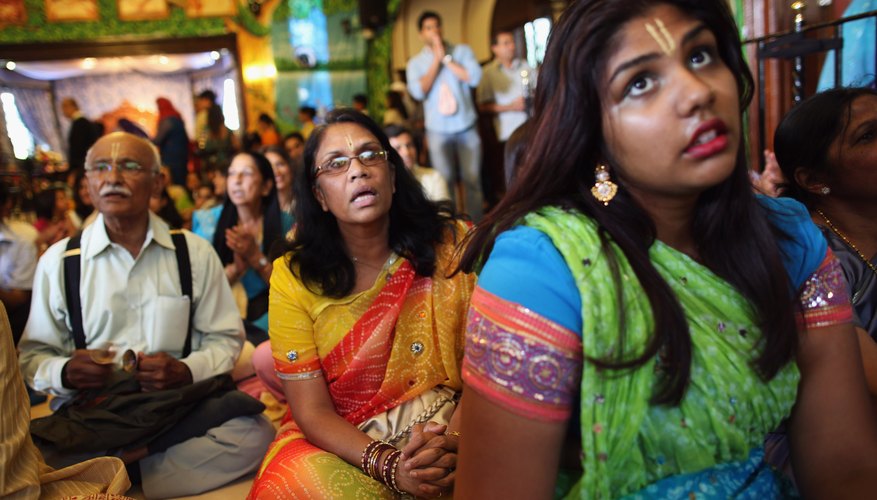People pray inside a Hindu temple.