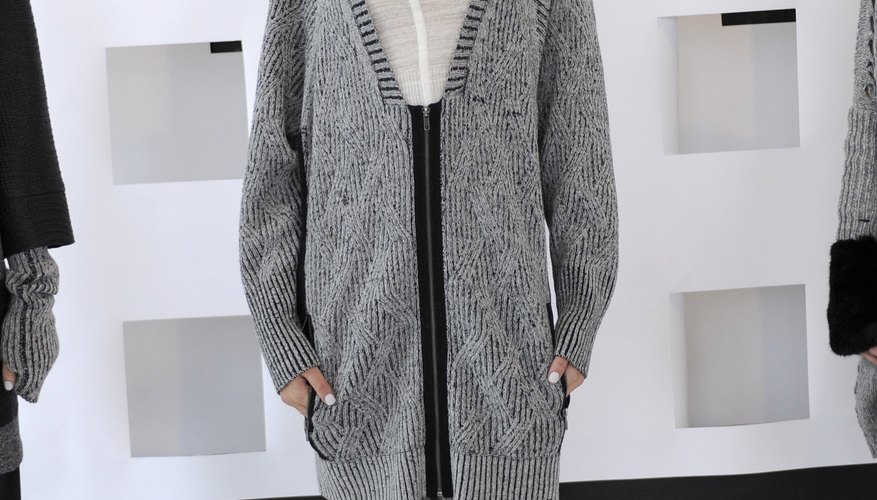 A model wears a long gray cardigan over a thin white tee for a head-to-toe neutral look during Fashion Week in New York in February 2014.