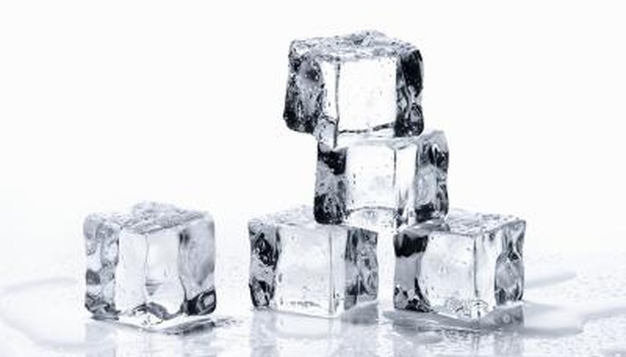 The white flakes that can sometimes be seen in ice cubes are harmless carbonates.