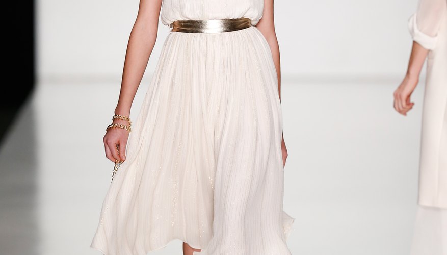 Metallic belts and strappy sandals with sparkling details bring colorless cloth to life.