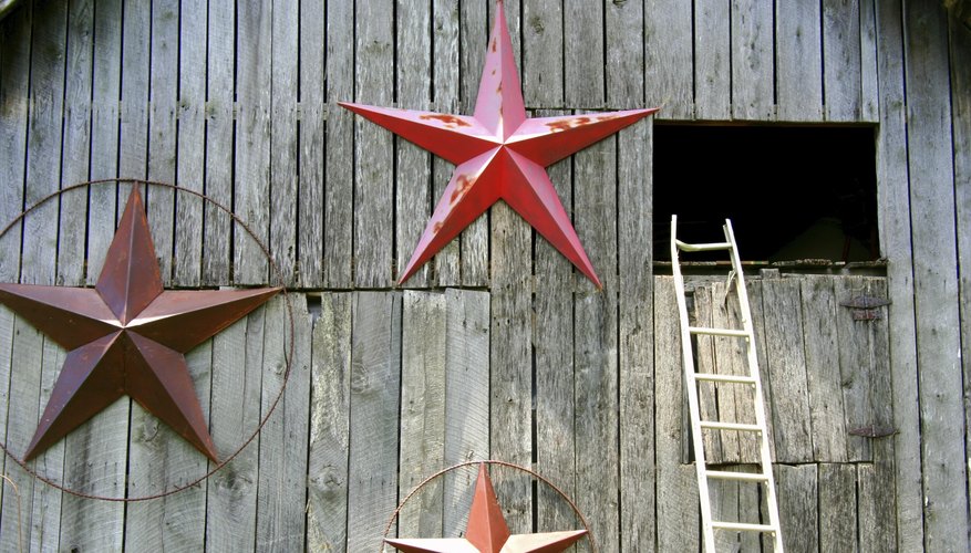 Three large barn stars on a barn near the hay loft.