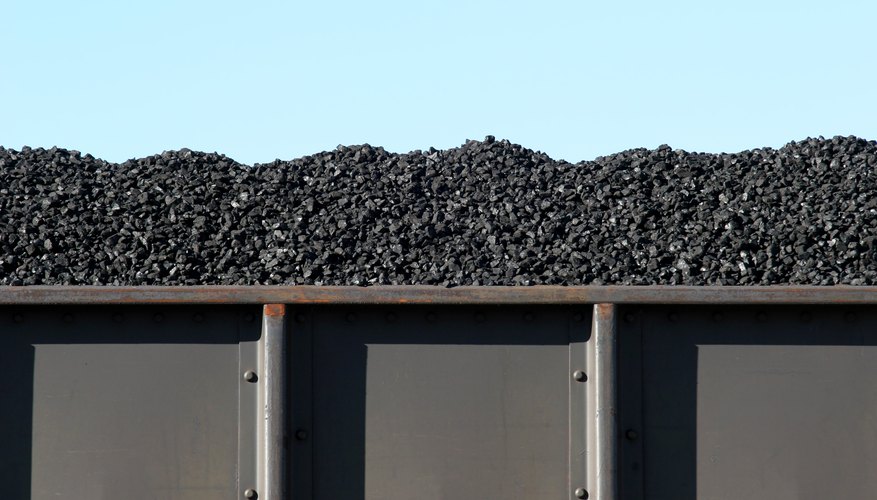 A boxcar filled with coal.