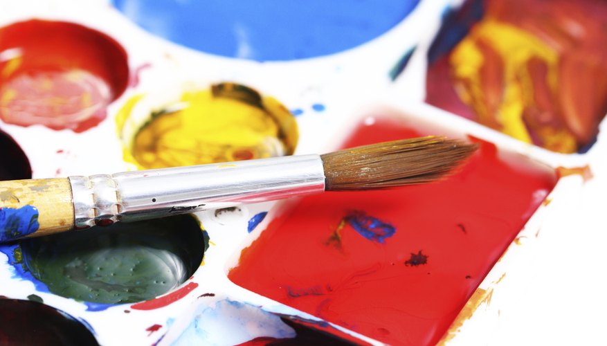 Close-up of paintbrush and watercolors