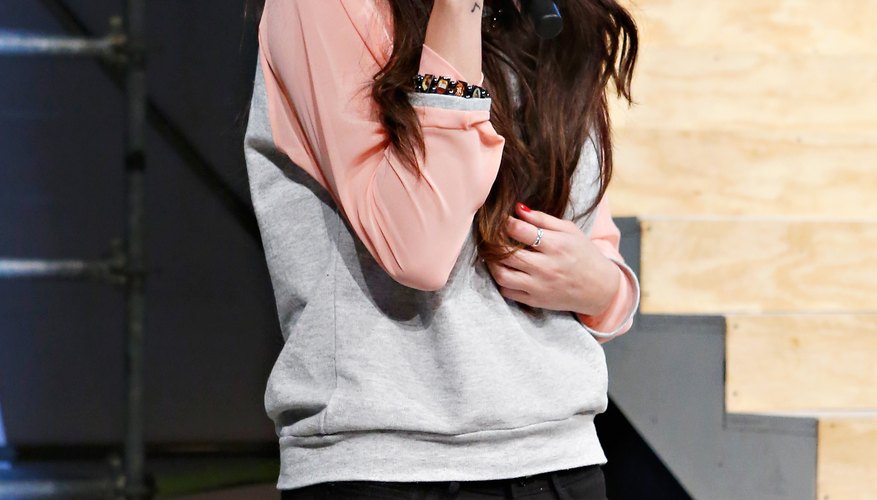 Selena Gomez sports a sweatshirt during her speech at the Adidas NEO Label fall 2013 fashion show during Mercedez-Benz fashion week.