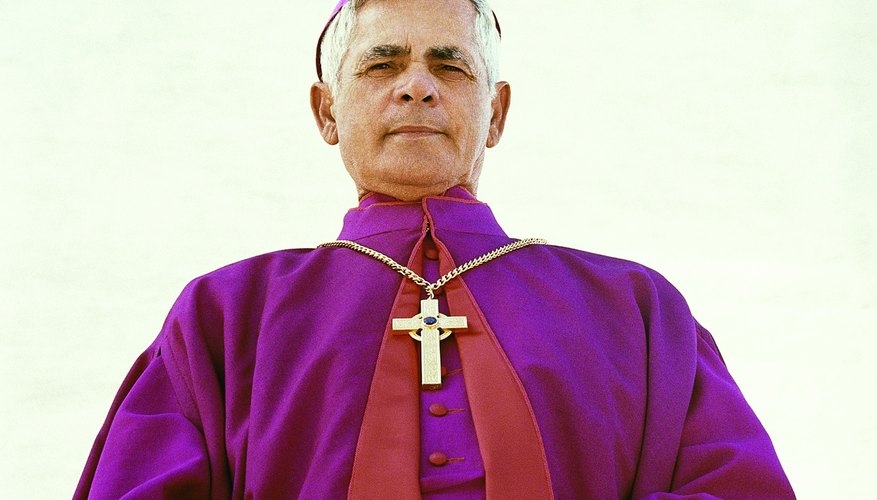 The priest wears a violet stole to administer the Sacrament of Penance.