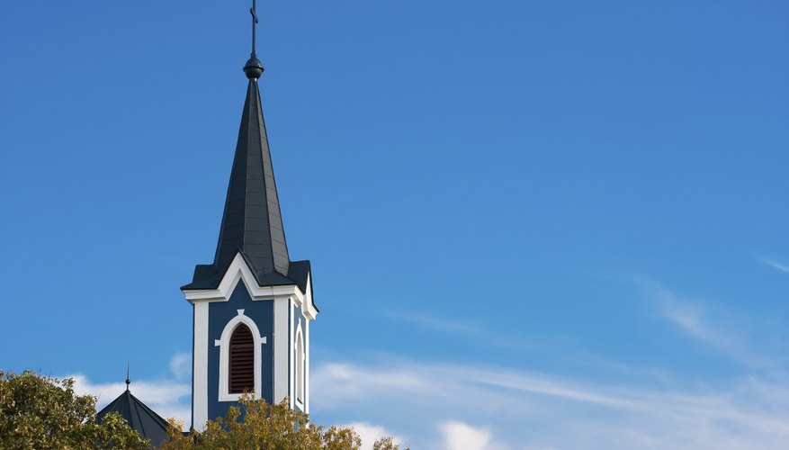 Church steeple against blue sky