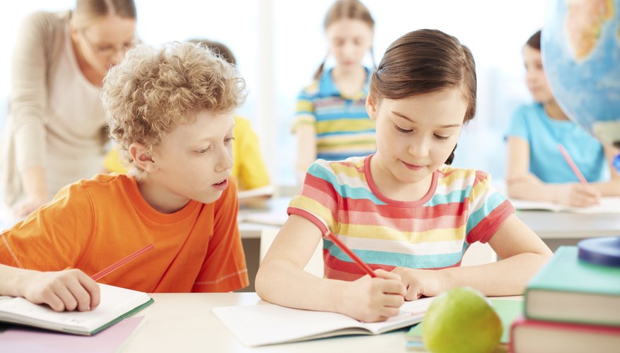 Elementary class taking notes
