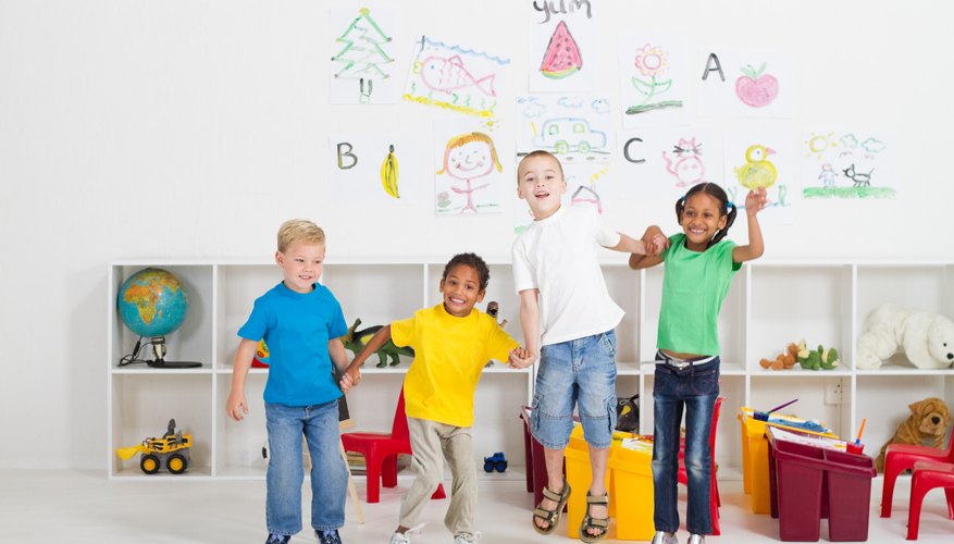 Kindergarteners celebrating in classroom.