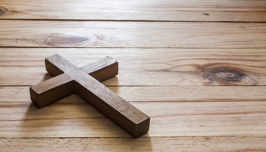 A cross on a wood surface.