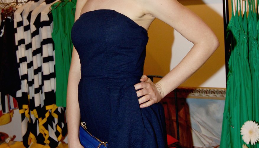 Throw a cardigan over a classic navy dress for a perfectly preppy look.