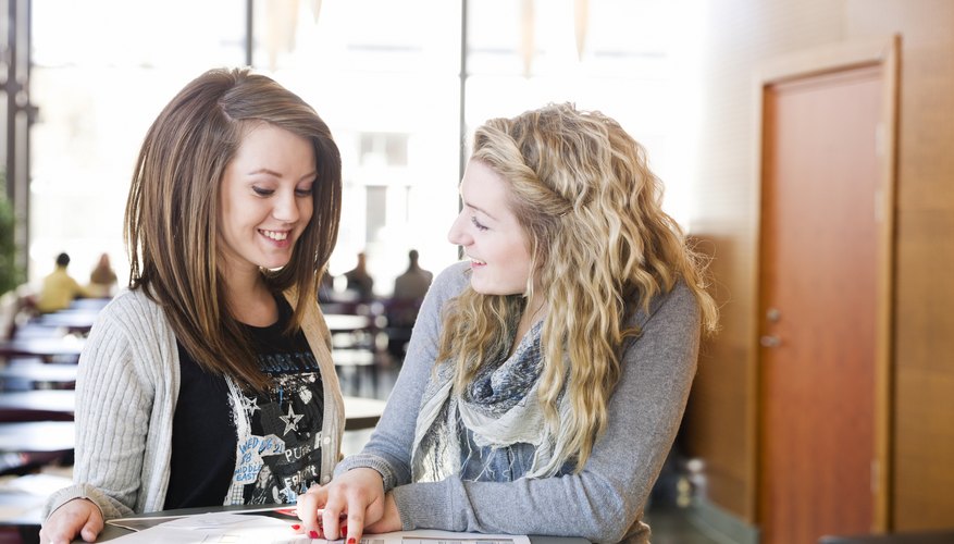 Two students studying in library.