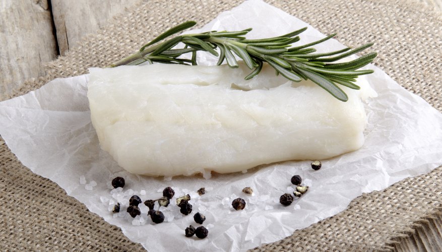 Fresh cod with salt, pepper and rosemary.