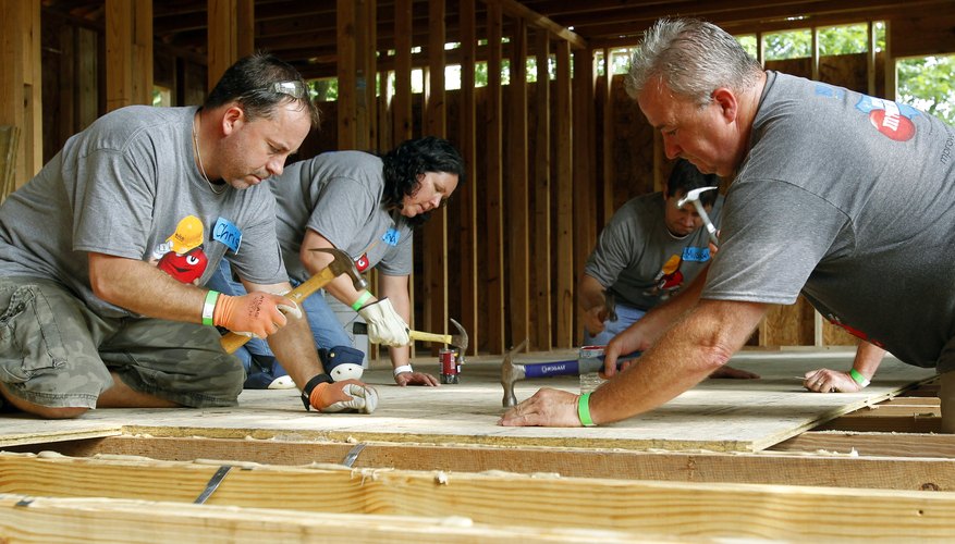 Habitat for Humanity volunteers building a house