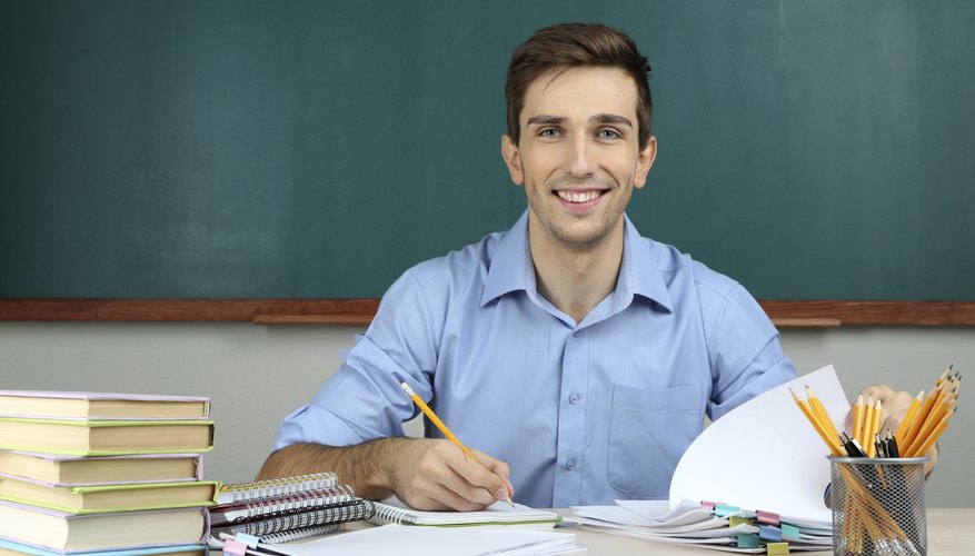 Professor grading papers at desk