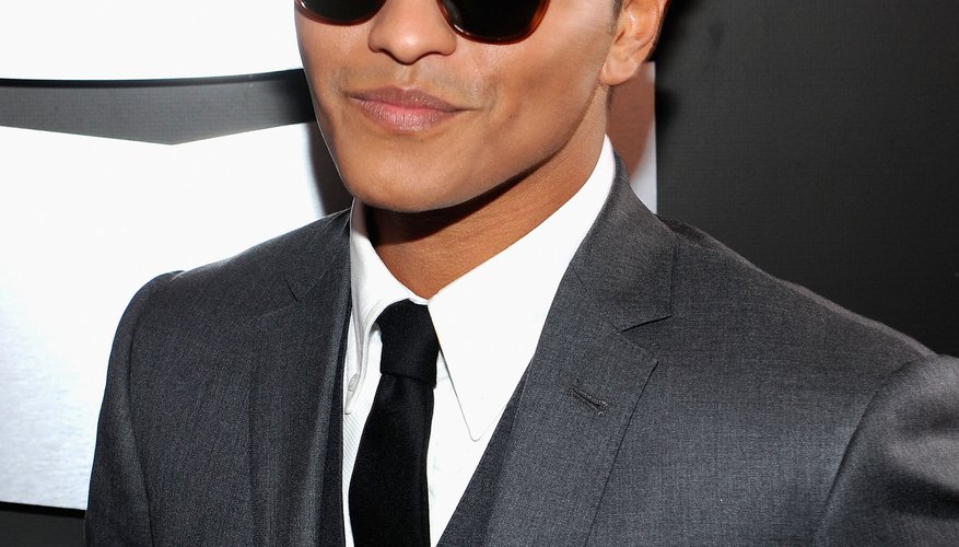 Bruno Mars often balances out a tailored suit with a pompadour.