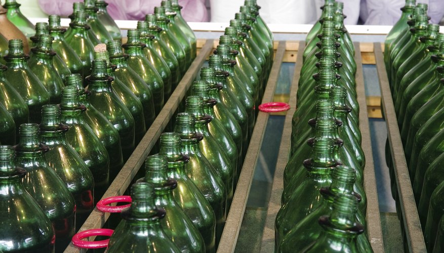 Bottles at a ring toss carnival game.