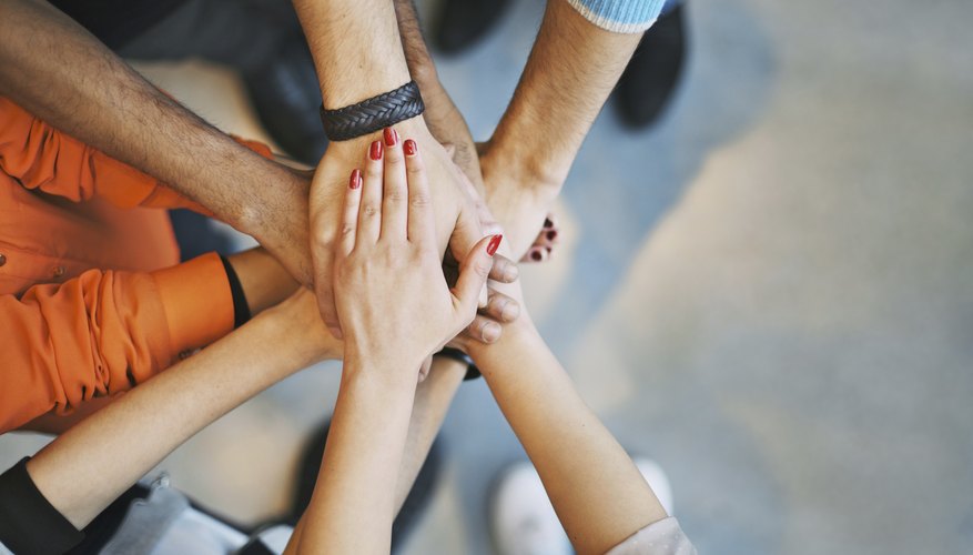 Image of children's hands in the middle.