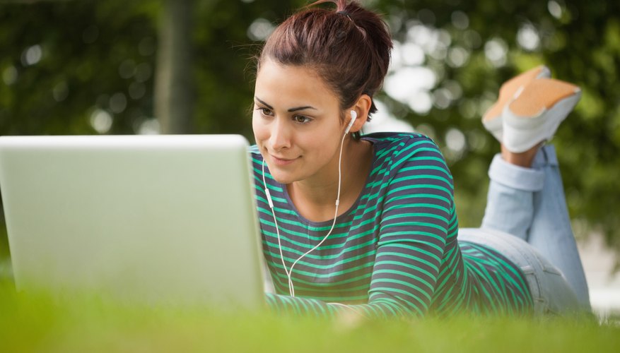 A student is typing on her laptop.