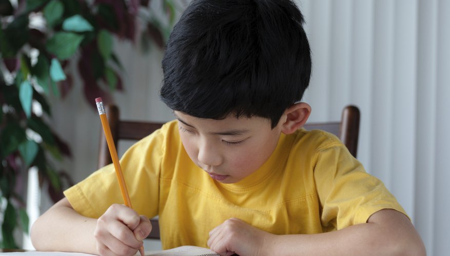 Nonverbal child writing on piece of paper