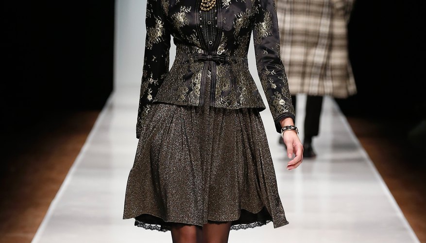 A model shows off an A-line skirt and blazer look at the Slava Zaitsev runway show in Russia for Mercedes Benz Fashion Week.