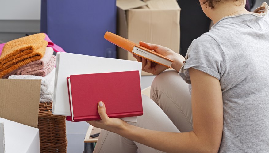 Student packing up boxes.