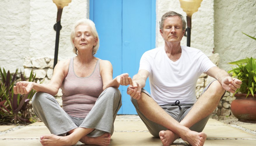 Senior couple meditating