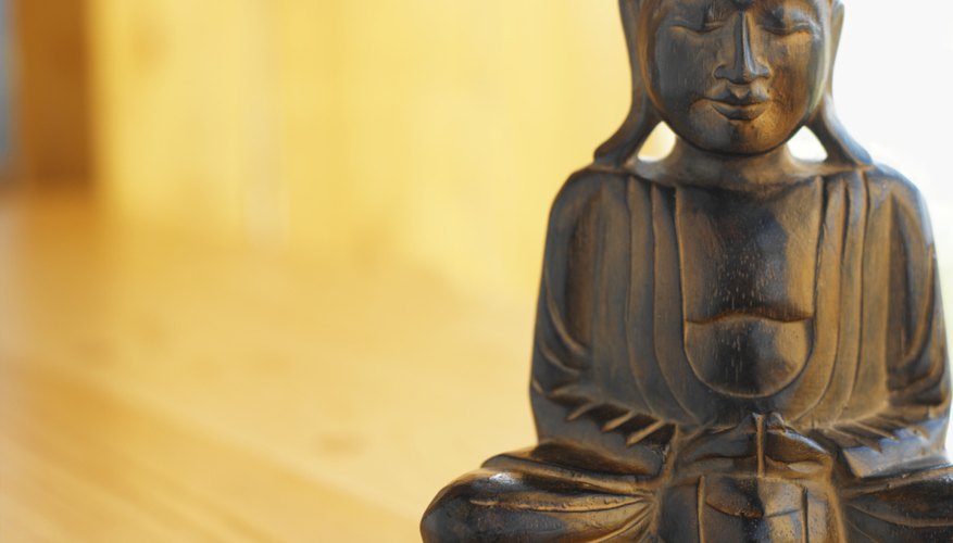 A statue often depicts a seated Buddha.