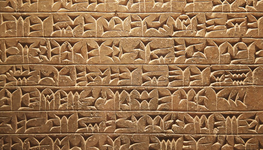Scribes made the characteristic wedge-shaped cuneiform symbols by pressing a stylus into soft clay.