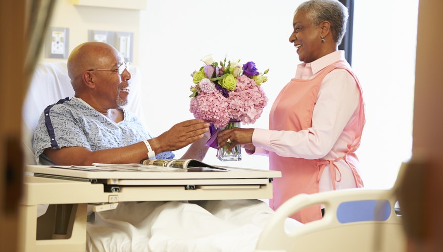 Male patient receiving flowers.