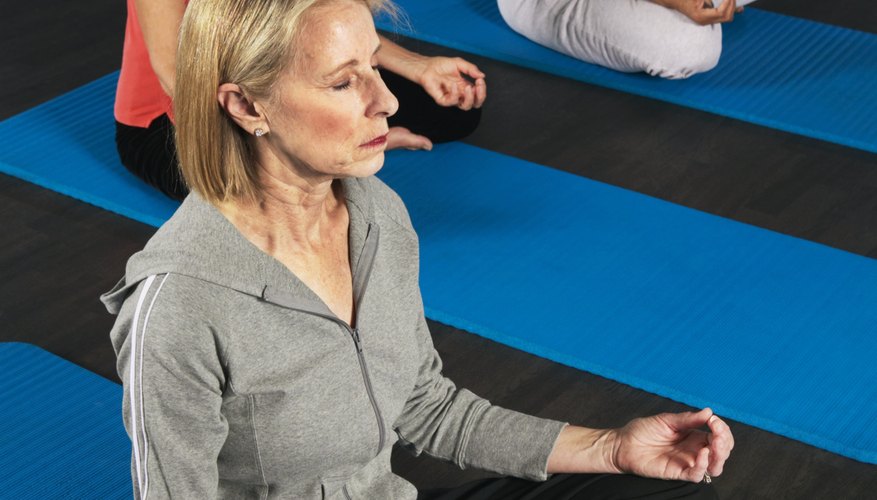 Participants focus attention on their body and breathing during a guided meditation.