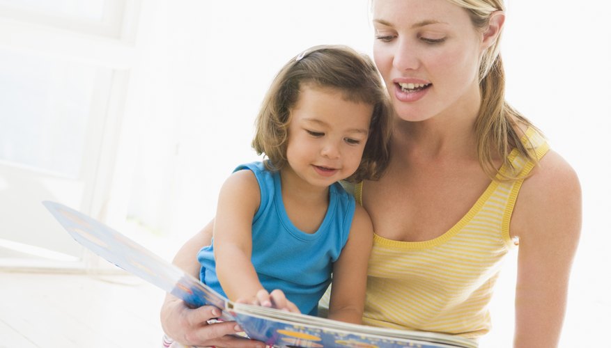 Mother reading with young child.
